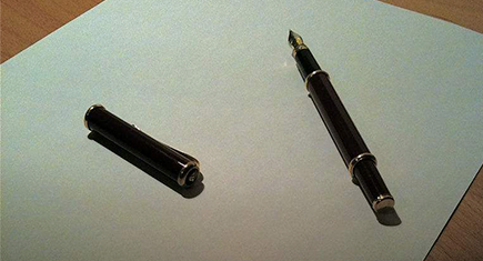 blank piece of paper and pen